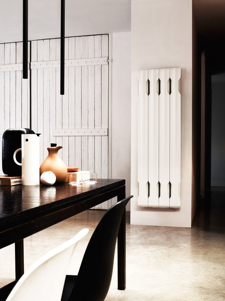 Aluminium Radiators in Agora Collection White Agora Radiator Placed in White Wall with Wooden Table