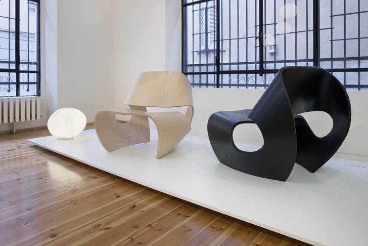 The Cowrie Chair Displays Cowrie Chair in the Laminate Woden Floor and Elegant Floor Lamp