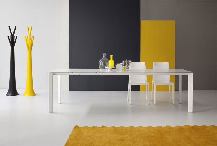 Bonaldo Table Concept White Kime Table Design and White Chairs Combines with Decorative Stuff and Yello Rugs