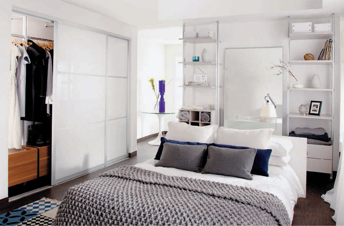 Decorate Small Bedroom White Themed Bedroom Arrangements with White Sliding Door Wardrobe and White Wooden Shelf