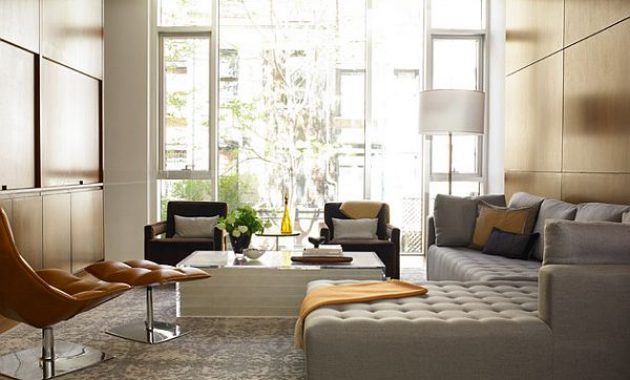 elegant-living-room-with-tufted-sectional-l-shaped-sofa-and-glass-table-grey-cushion-white-framed-glass-door