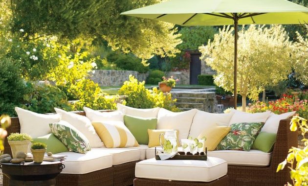 White Mallin Outdoor Furniture Replacement Cushions on Brown Wicker and Green Umbrella