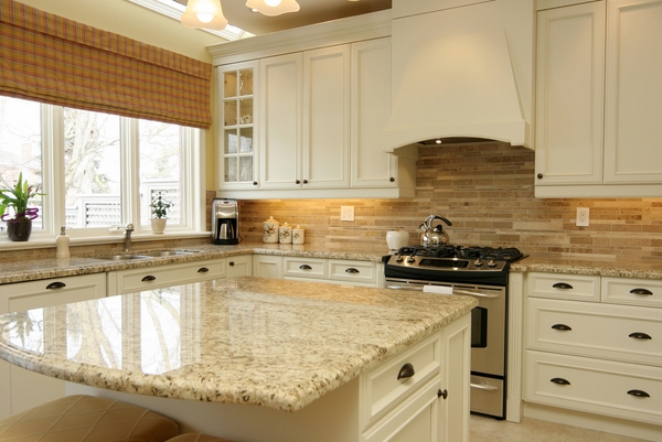 White Kitchen Theme with Giallo Ornamental Granite Countertops with Cabinet