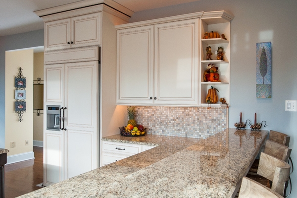 kitchen Island Design with Giallo Ornamental Granite Countertop and White Cabinets