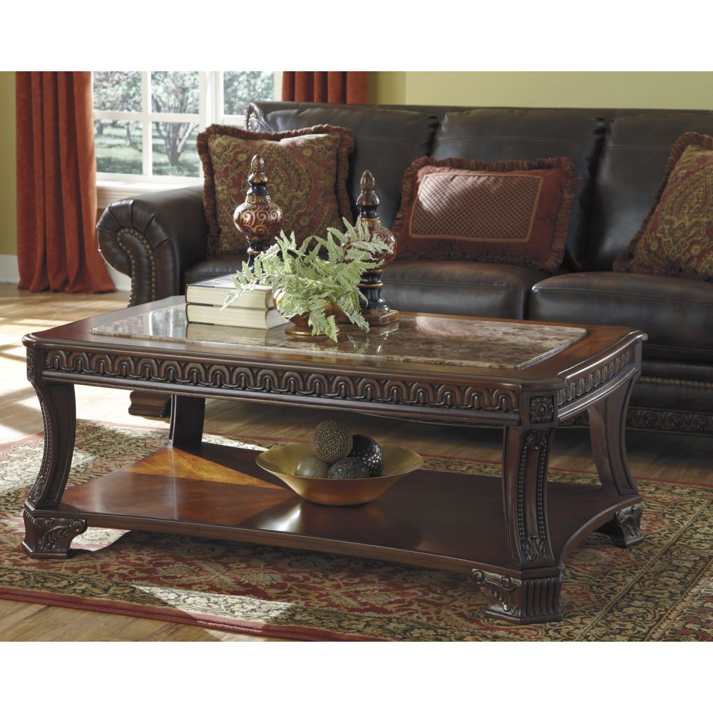 contemporary living room with bold carved wooden norcastle coffee table and glossy top