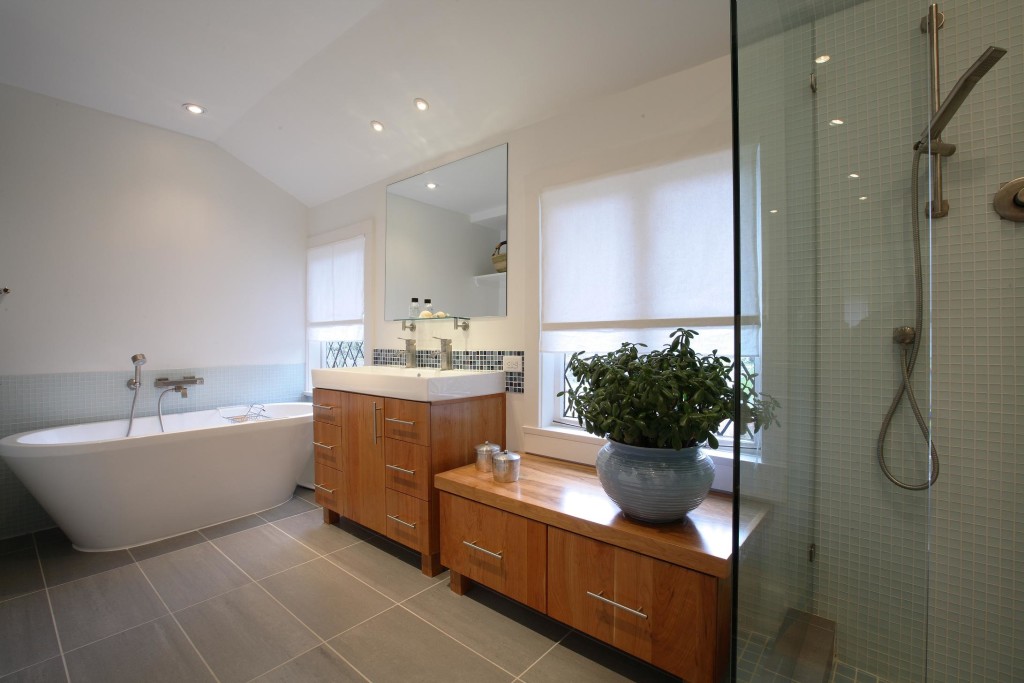 Elegant Bathroom Decoration Design with Large White Bathub and Wooden Vanity Sets plus Ceramic Sink