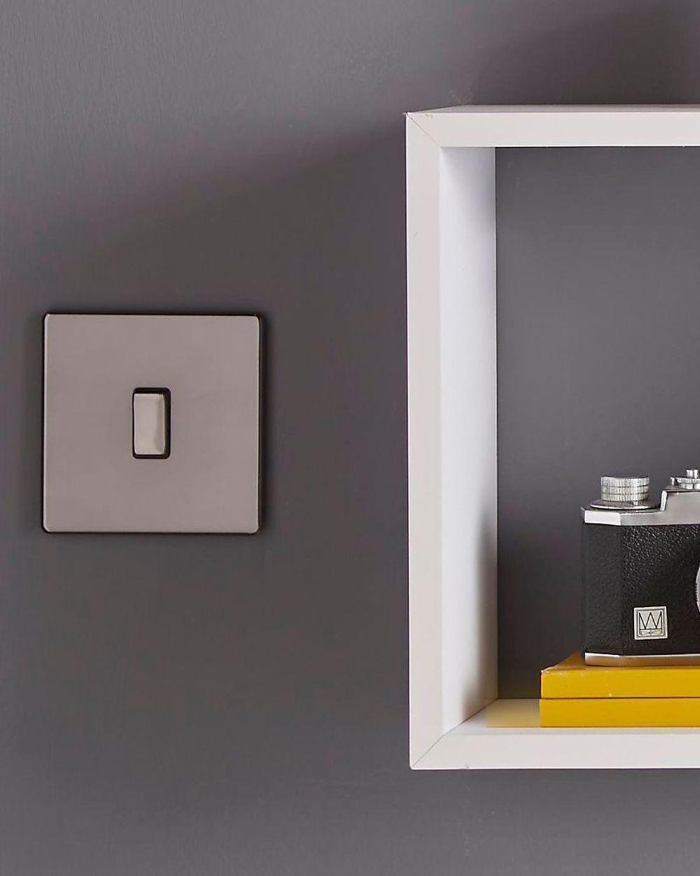 elegant modern mobile home style with grey light switch with white cubical shelving unit on wall