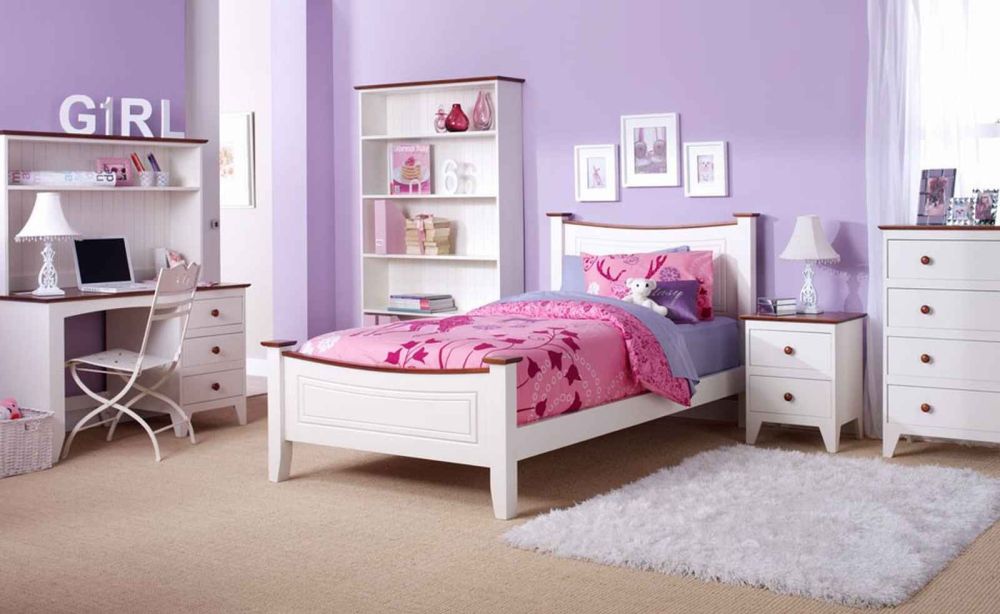 elegant nuance little girl’s bedroom with purple walls paint and white bed frame with pink bedding set
