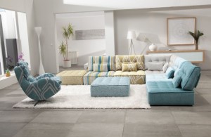 large living room with white walls and turquoise seating square ottoman standing on a luxurious white furry rug remarkable sectional sofas inducing elegance and warmth in houston homes