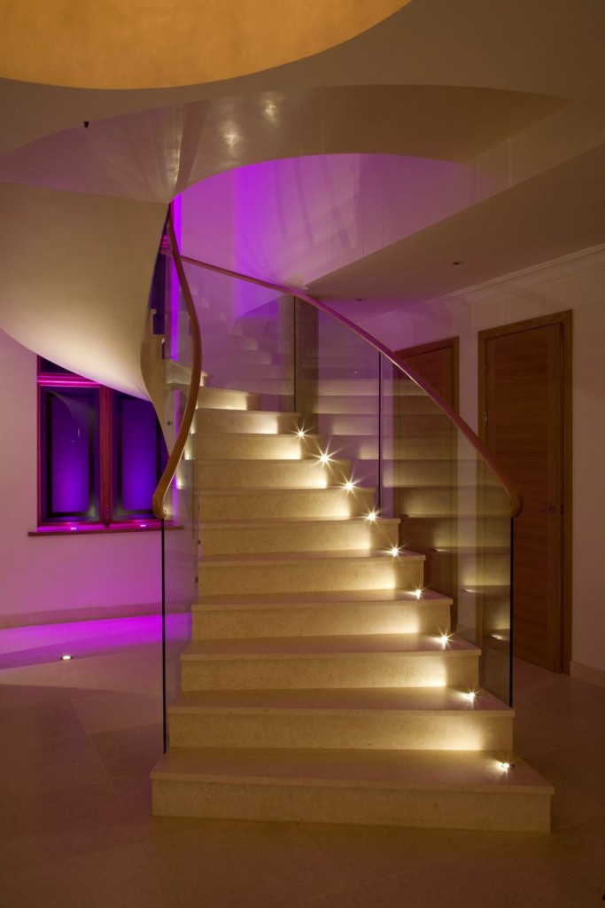 Pretentious Helical Staircase with Exotic Purple LED Lighting from Behind and Above Wall Decor
