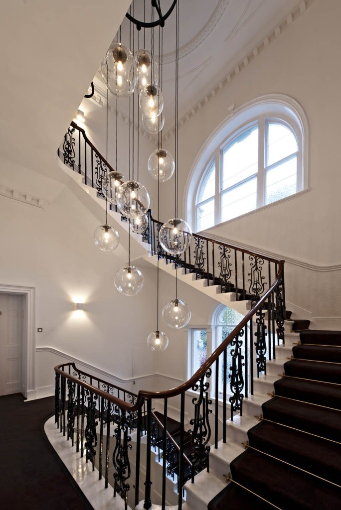 Traditional Spiral Staircase with Round Globe Filament Pendant Lighting
