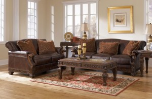 dark brown sofas from the distressed leather with the snazzy retro pattern cushions and the carved solid wood frame durable snazzy distressed leather sofa coming with humble outlook