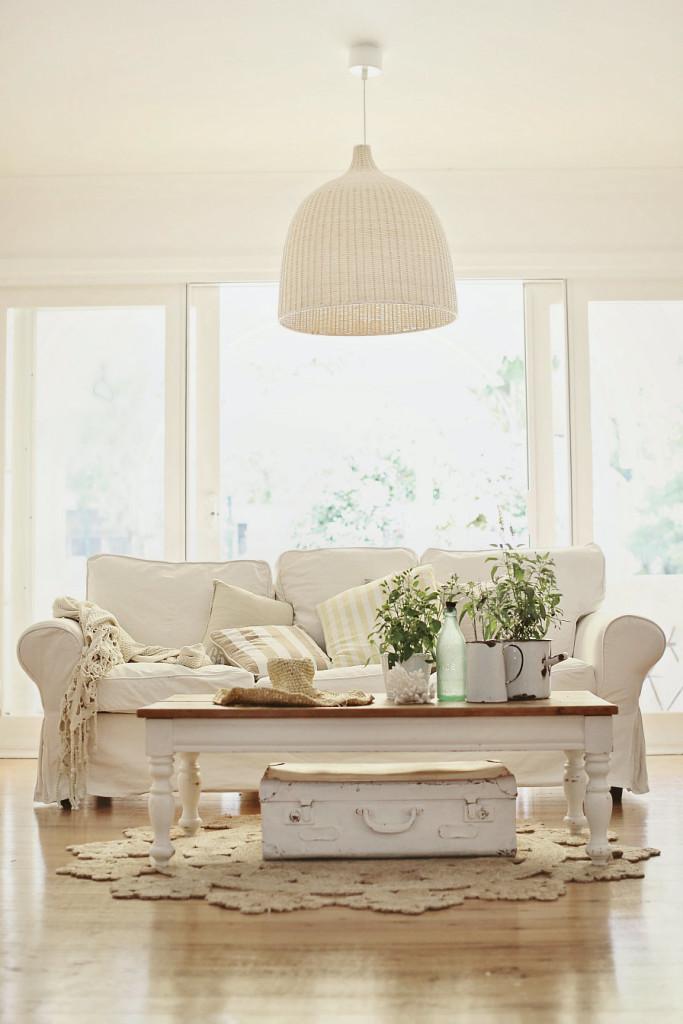 White Scheme Living Room with White Slipcovered Sofa with Wooden Coffee table