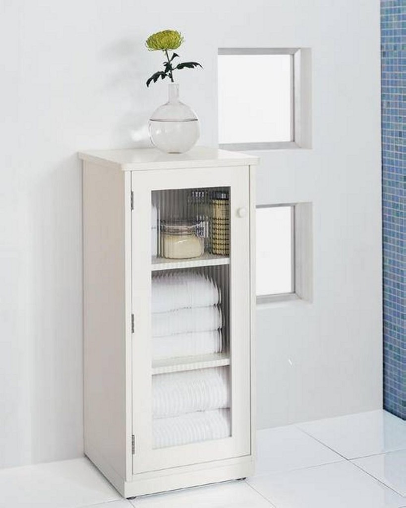 Simpler Linen Tower Design in Pure White Color with The Glass Accent Applied on The Door