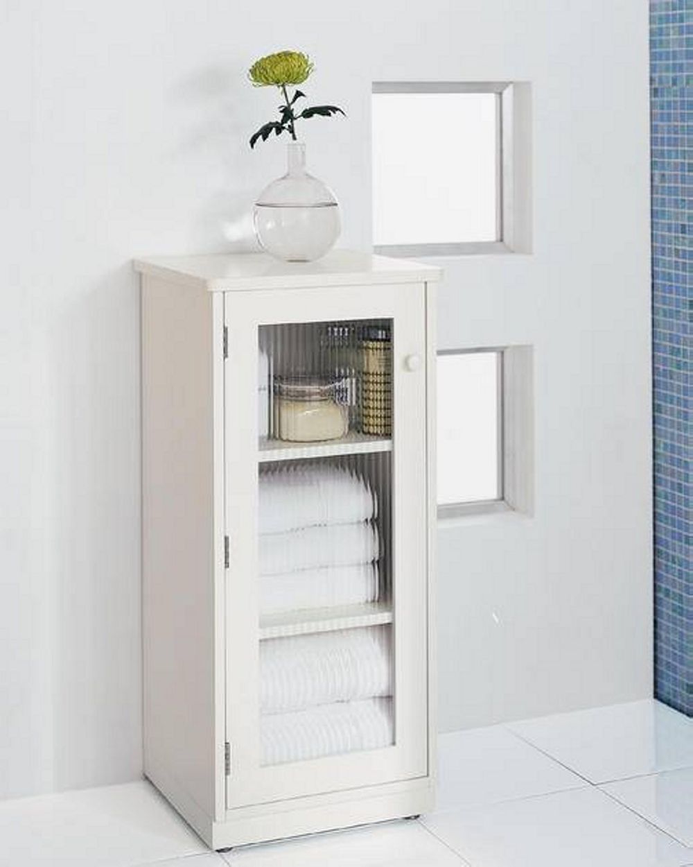 simpler linen tower design in pure white color with the glass accent applied on the door bathroom linen tower – space saver storage idea