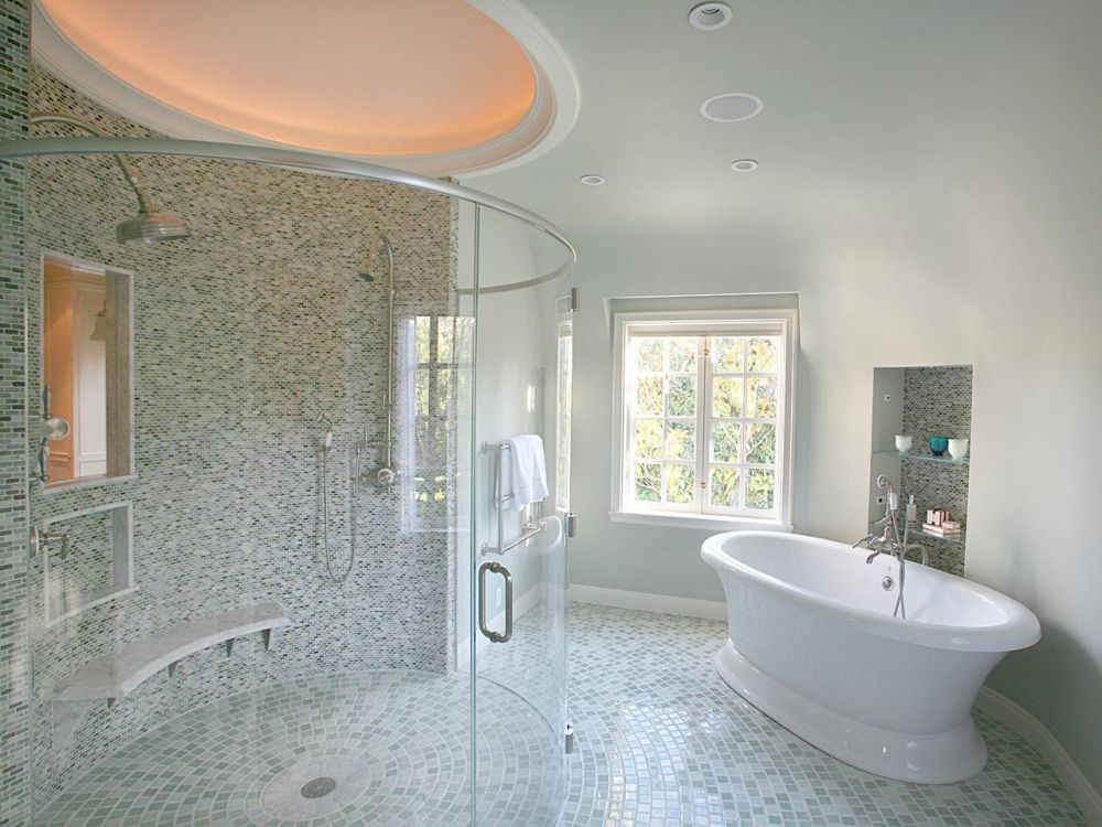 elegant glossy white bathtub with brass showerhead and recessed bathroom shelves promote glass shelves rejuvenating for bathroom flooring options